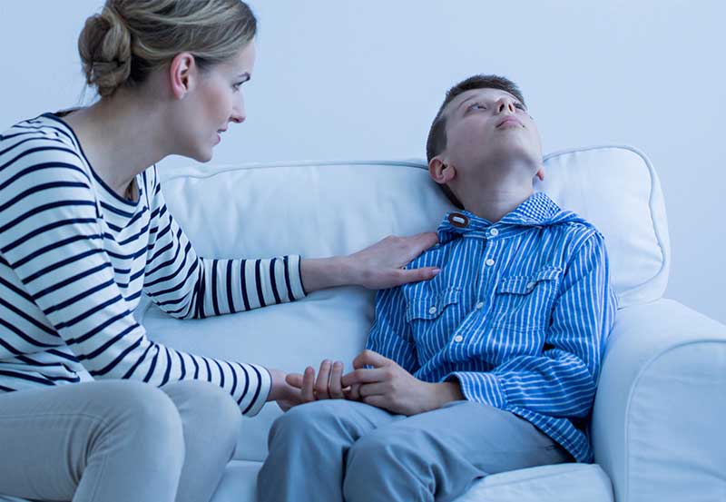 autistic-boy-being-comforted-by-mother-vanguard-psychiatry