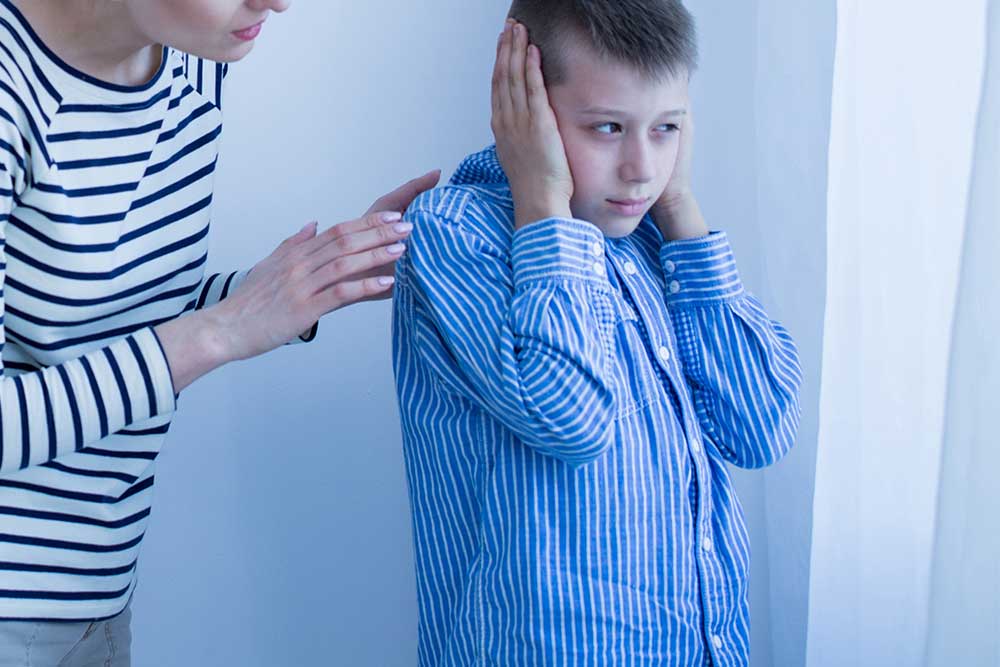 autistic-boy-covering-ears-image-vanguard-psychiatry